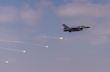 Jordanian F-16 Fighting Falcon deploys flares during Exercise Eager Lion in Jordan military jet deploys flares in air