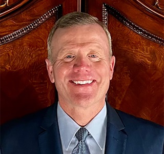 headshot of male smiling