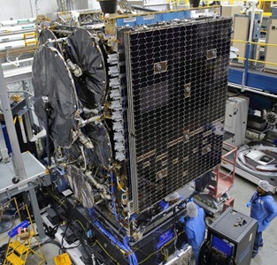 Northrop-Grumman-Completes-Essential-Tests-for-Arctic-Region-Satellite-Communications-Program technicians in highbay working on a satellite