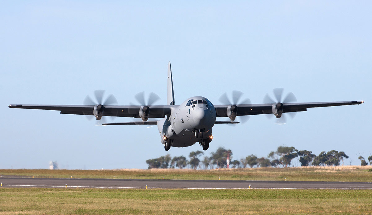 C-130 taking off on runway