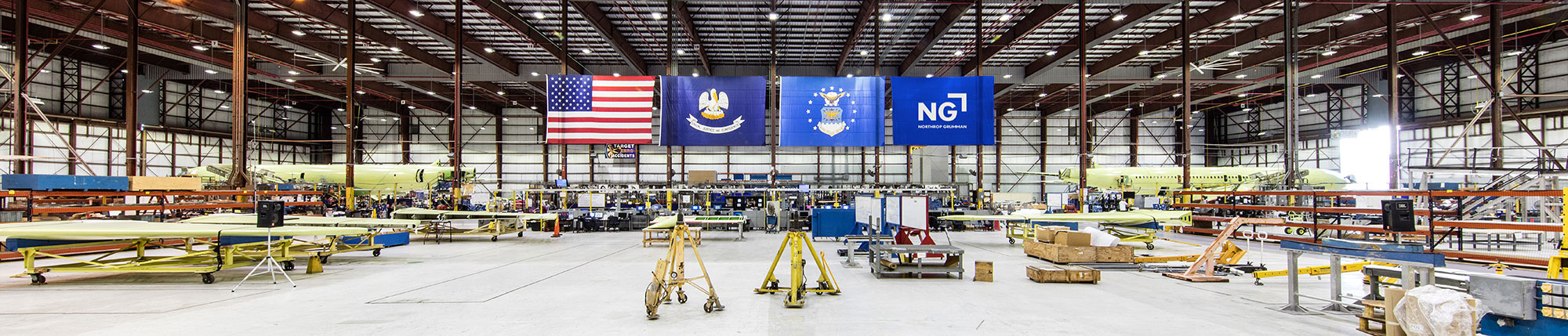 Large hangar with flags hanging from ceiling