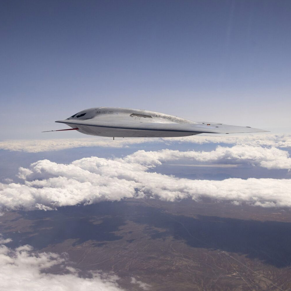 B-21 Raider flying above clouds