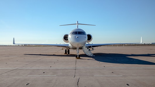 military aircraft sitting on runway