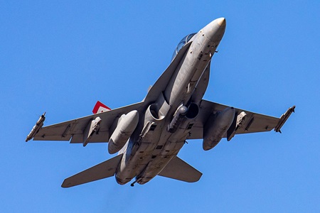 Northrop Grumman Modernizes LITENING Secure Data Links for US Marine Corps Aircraft military jet ascending in flight in blue sky