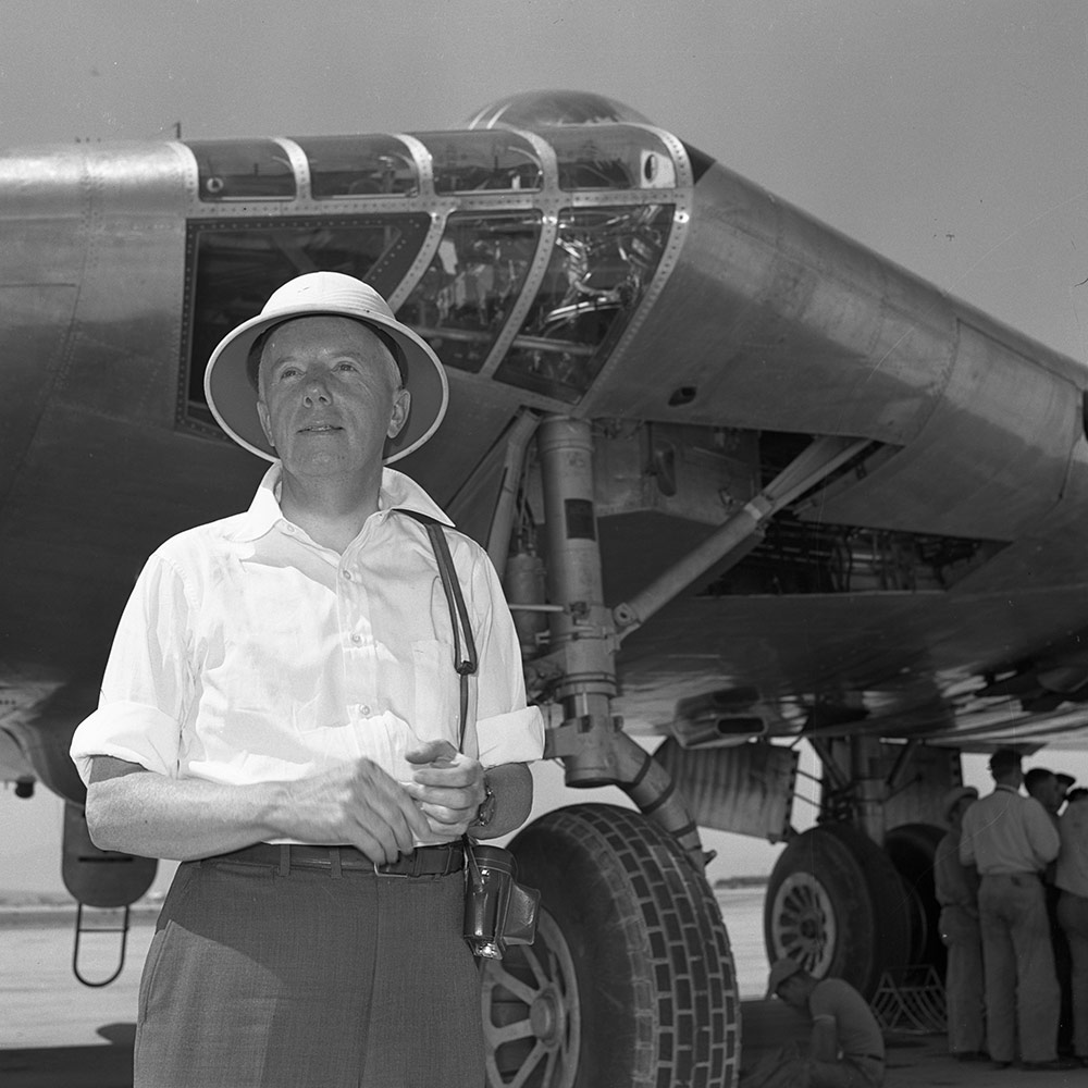Jack Northrop standing in front of a Flying Wing aircraft