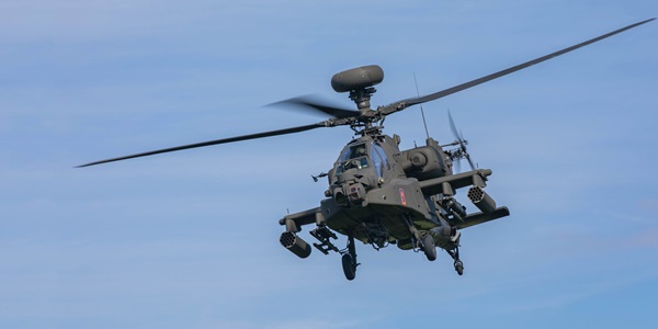 army apache helicopter flying in sky