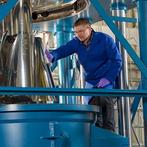 man in blue lab coat