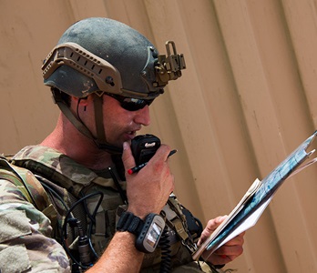 JTAC communication military man speaking into handheld receiver
