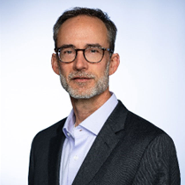 headshot of man dressed in business suit