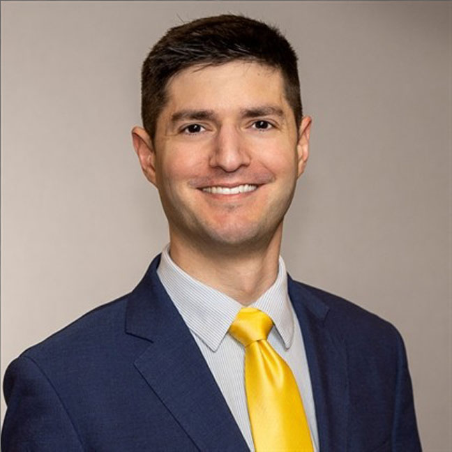 headshot of man dressed in business suit
