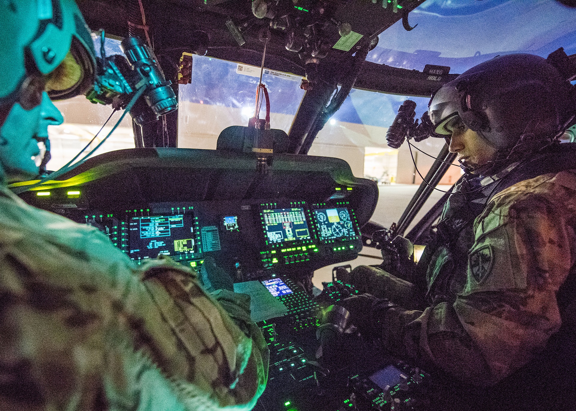 illustration of soldiers in cockpit of military helicopter