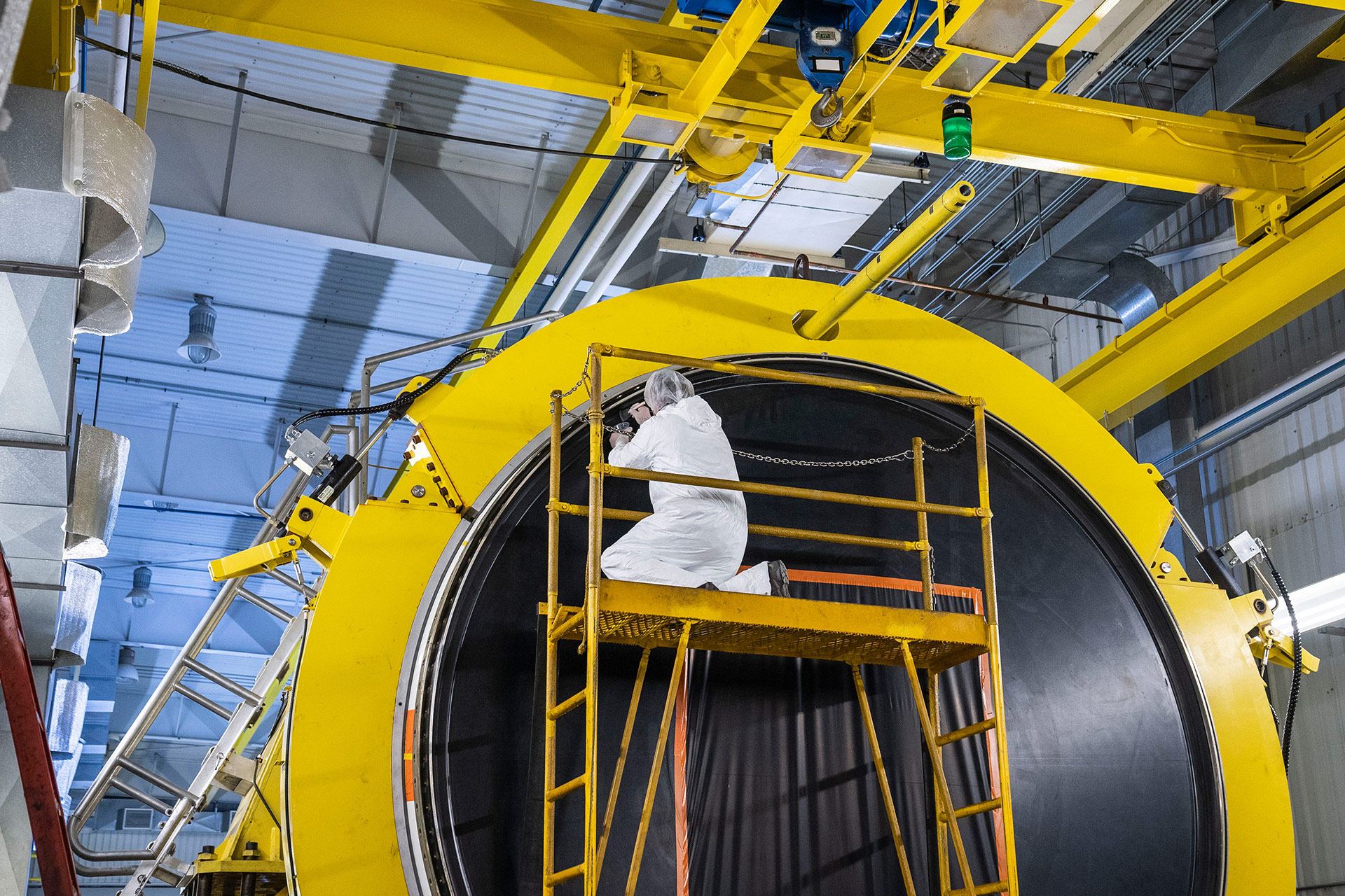 Engineer working on section of booster rocket