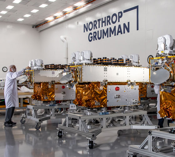 Employees work on the production line for the Tranche 1 Tracking Layer satellites in Northrop Grumman’s Space Park campus in Redondo Beach, CA.