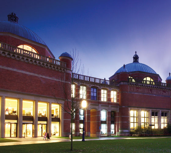 Photo of campus of University of Birmingham at night. 