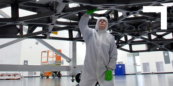 technician working on telescope
