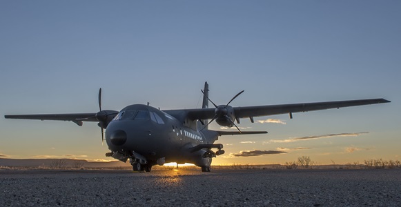 Special Mission Aircraft Military aircraft with sunset behind it