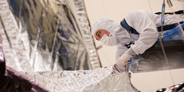 Life at Northrop Grumman Stories A Northrop Grumman employee inspects the James Webb Space Telescope Sunshield.