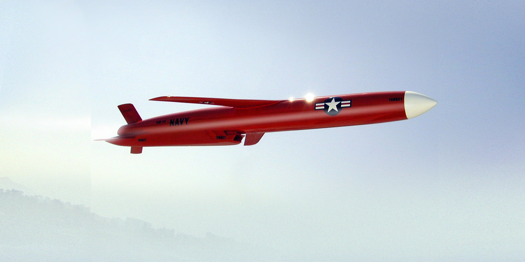 BQM-74F Aerial Target orange aircraft inflight against blue sky