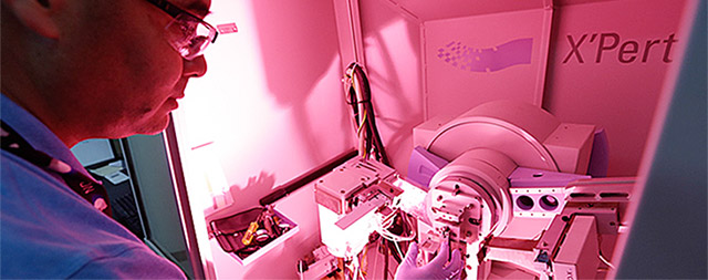 Chemistry-Services-Slide Technician using advanced instruments and equipment