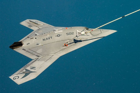 UCAS X-47B Unmanned military aircraft refueling in air