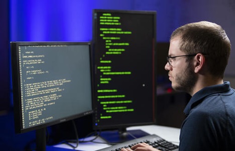 Cyber Capture-Annapolis Junction-MD-06-10-2020_4669_JPG Northrop Grumman Employee looking at computer screen.