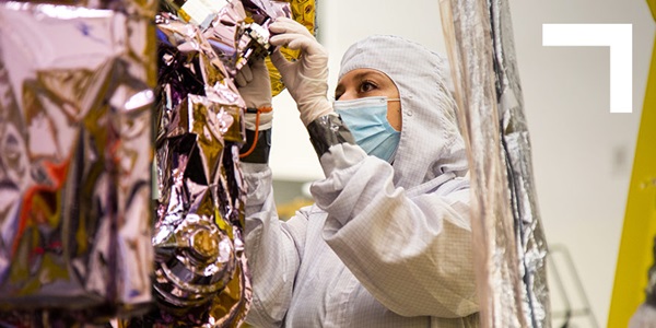 Female engineer working on spacecraft