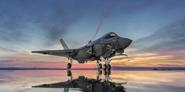 F-35-Lightning-Hero-2000x1000px-v2 fighter jet at rest on dry lake bed during sunset
