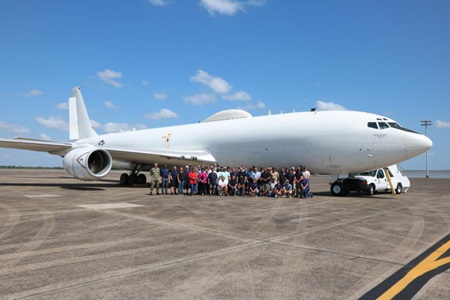 First E-6B Inducted Under New Maintenance Contract Navy aircraft on tarmac with sustainment workers