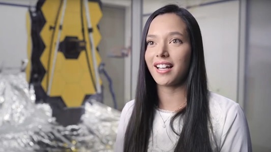 From Intern to Mechanical Design Engineer on the James Webb Space Telescope white female smiling in front of space telescope