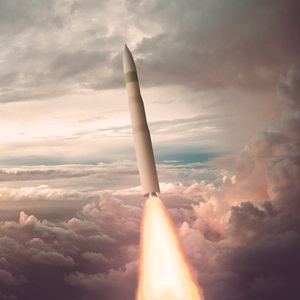 An intercontinental ballistic missile blasting through clouds