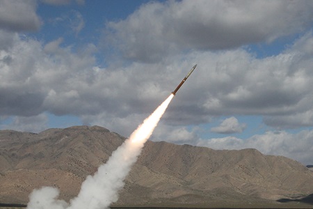 Guided Launch Rocket System Motor Rocket being launched against cloudy sky and mountains Rocket
