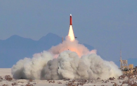 IBCS A New Era in Air and Missile Defense Missile launch in desert with mountains in background