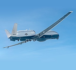 MQ-4C Triton Completes First Flight in Multi-Intelligence Configuration – Photo US Navy unmanned surveillance plane flying in blue skies
