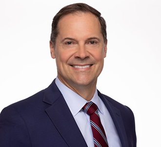 Michael Witt, Northrop Grumman Vice President and Chief Sustainability Officer a man in a suit smiles at the camera