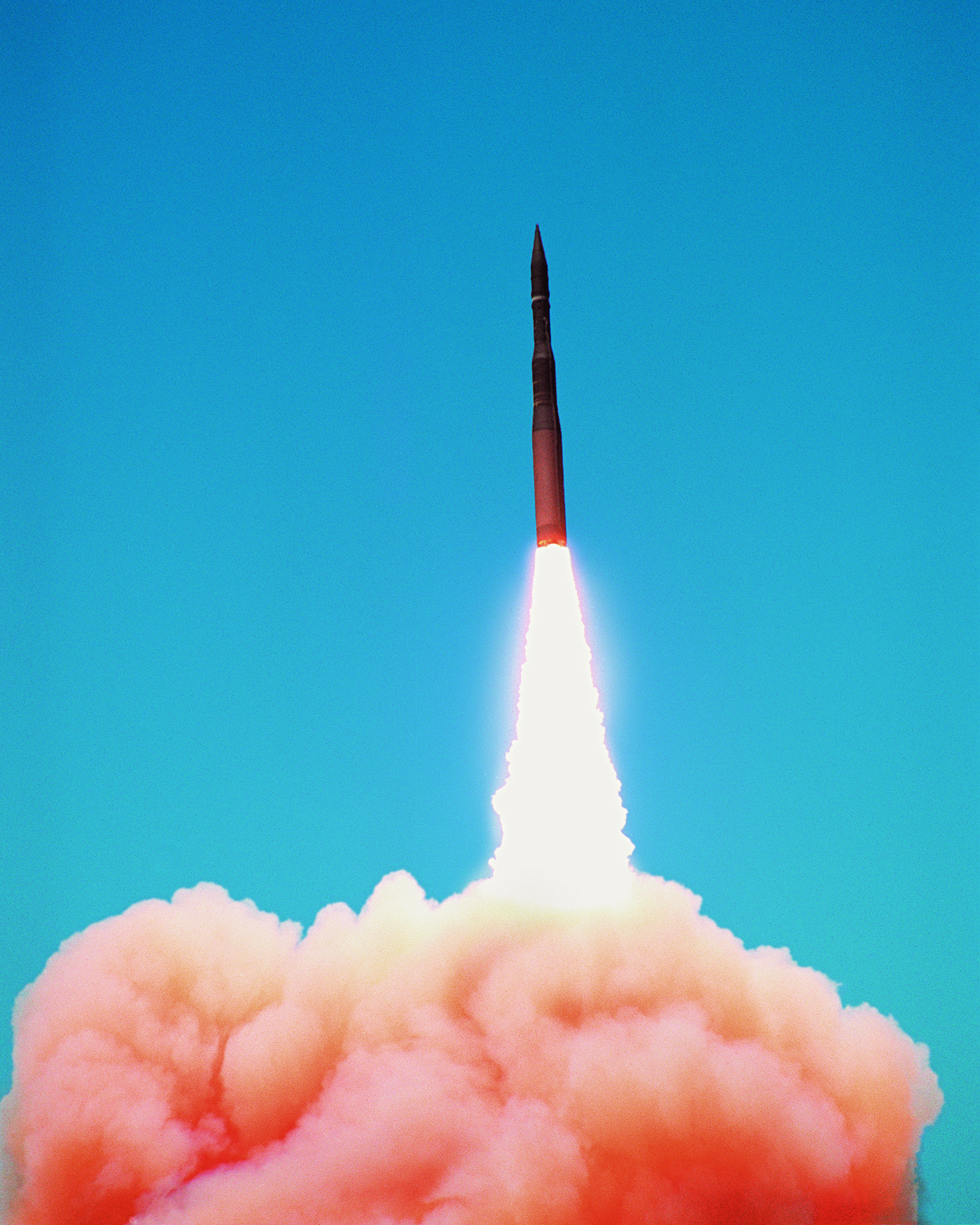 Minotaur II rocket launching in front of blue sky