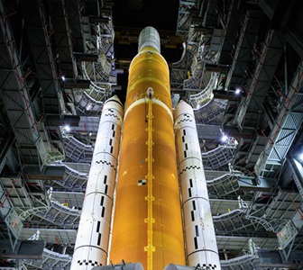 NASA Booster Artemis Program Space Launch System rocket, with twin Northrop Grumman solid rocket boosters, awaits the first Artemis program launch