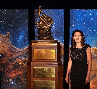 Northrop-Grumman-Honored-with-Prestigious-Collier-Trophy-for-NASA’s-James-Webb Space Telescope-2 woman standing next to trophy