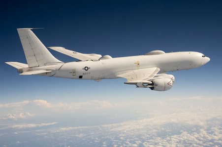 Northrop Grumman delivers first modified E-6 B Mercury as part of the Integrated Modification and Maintenance Contract (IMMC) for the U.S. Navy. (Photo Credit: U.S. Navy) white military aircraft flying above clouds