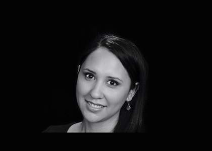 black and white headshot of woman smiling