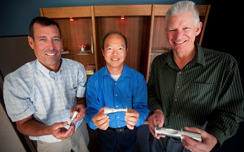 Northrop Grumman Pinch Polarizer Three Males holding polarizers with their hands