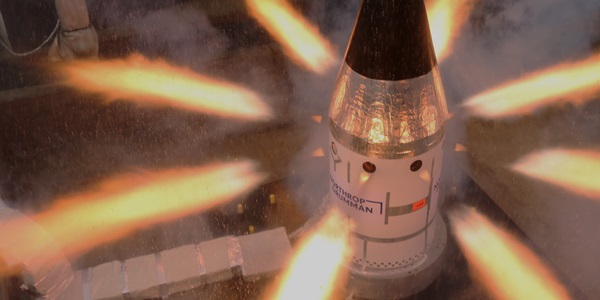 Orion Spacecraft’s Launch Abort System test spacecraft with flames shooting out of the sides
