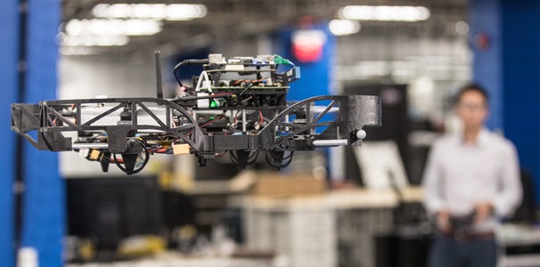 Quadcopters a drone in flight in a lab