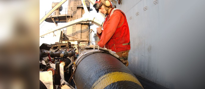 Specialized Team Sets Northrop Grumman Apart When it Comes to Integrated Fuze and Warhead Design Navy sailor putting munition on an aircraft