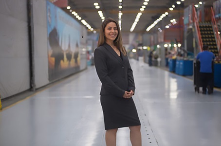 The First of Her Family hispanic woman in a large building