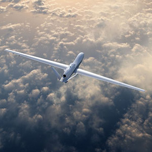 Triton aircraft flying above clouds