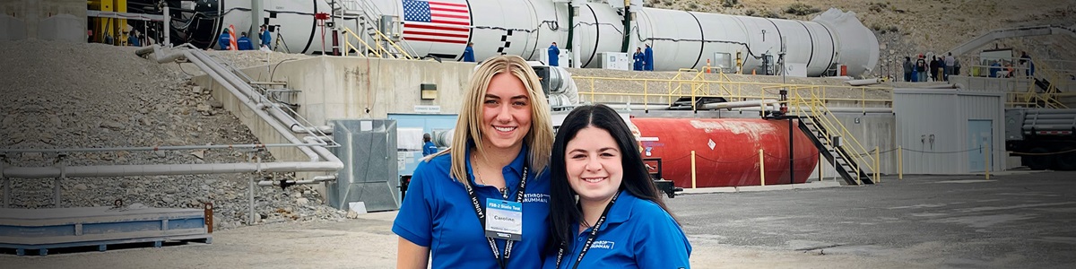 Two the Moon – Life at NGC – two women in front of rocket