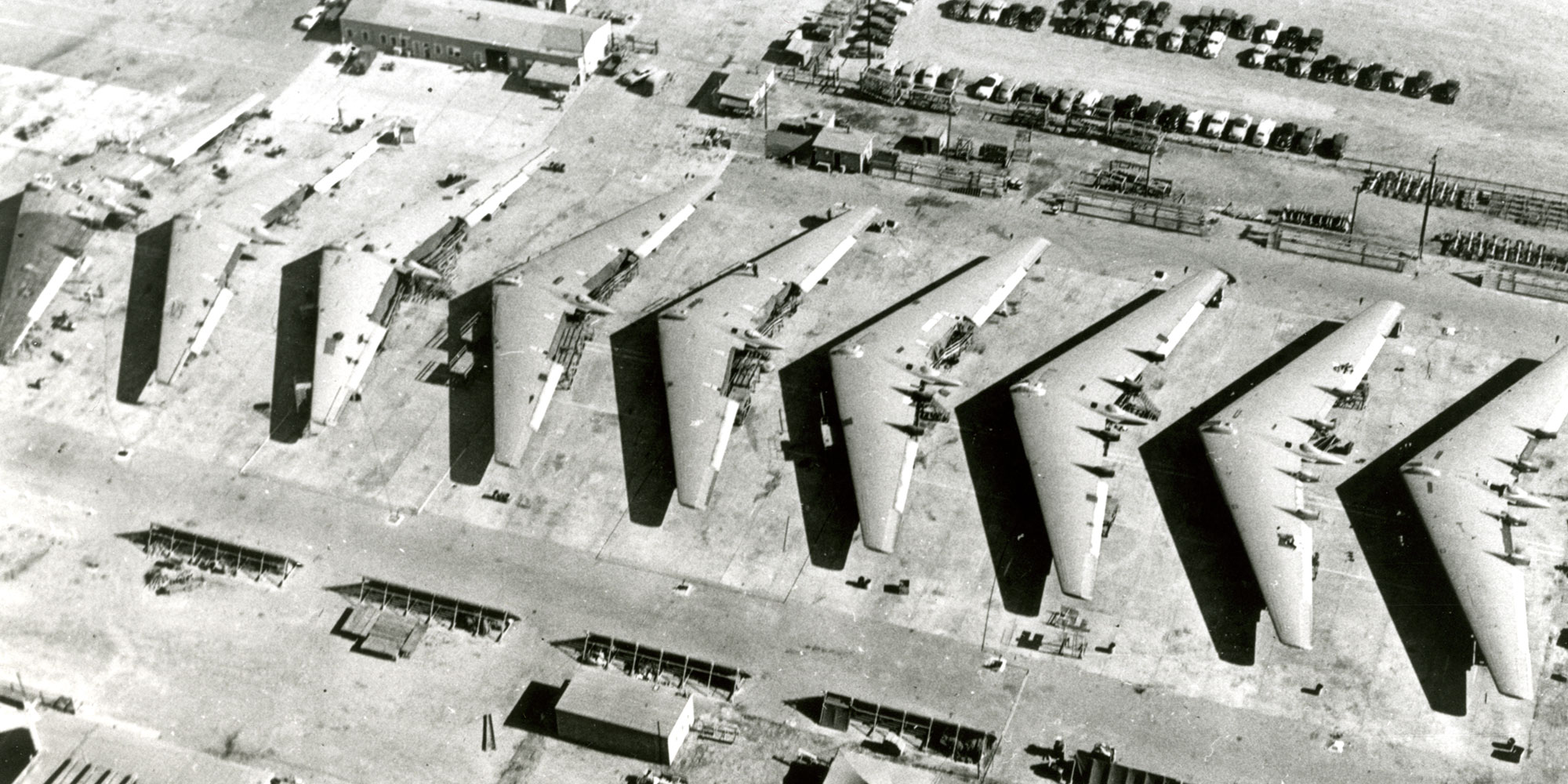 flying wing aircraft lined up on tarmac