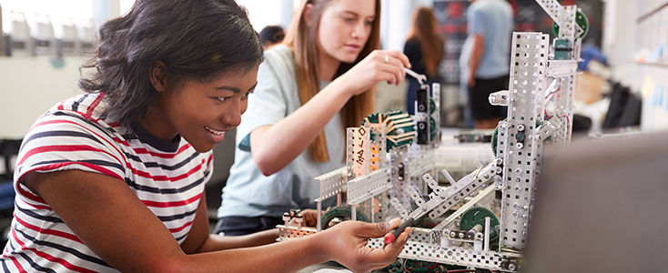 HIP – High School Involvement Partnership Mentoring Program students working with engineering tools