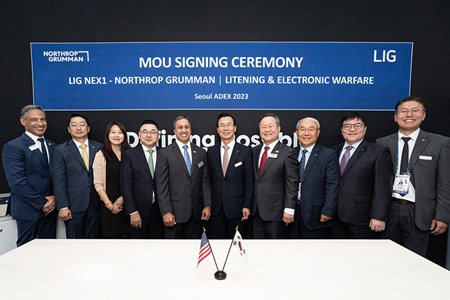 Northrop Grumman and LIG Nex1 to Collaborate on Electronic Warfare Systems for Korea men and women in business suits lined up for photo under sign
