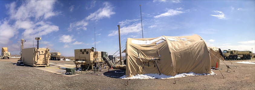 Northrop Grumman’s Integrated Battle Command System Achieves Initial Operational Capability military tents with equipment set up in desert